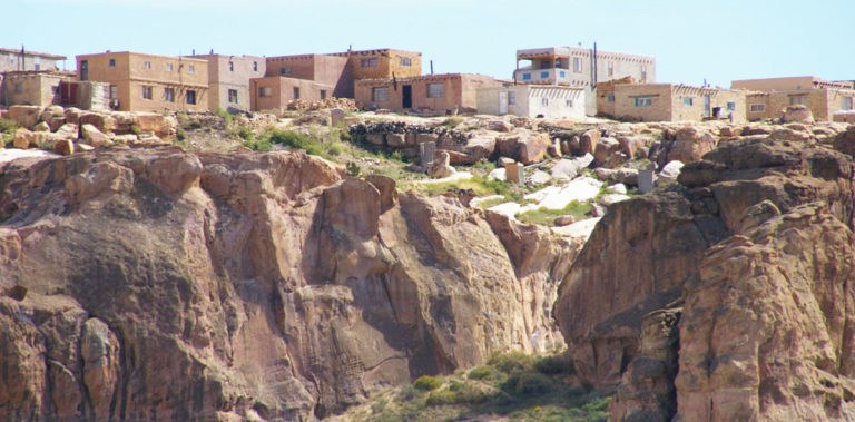 A side view of Acoma Pueblo on top of its mesa