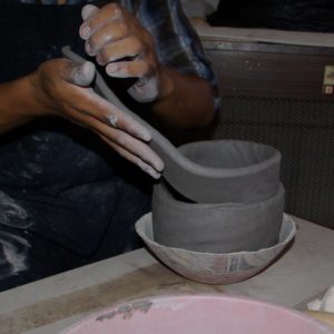 Adding the second coil of clay