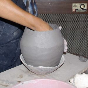 Stretching and shaping the pot from inside