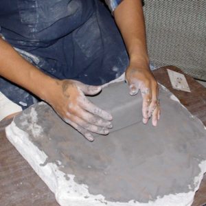 Form the clay into a block and let it stand overnight to get ready