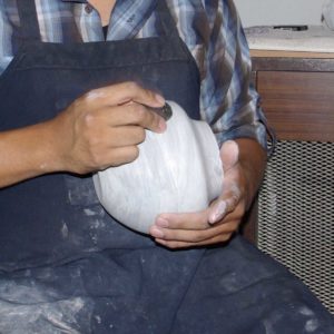 Polishing with a round river rock