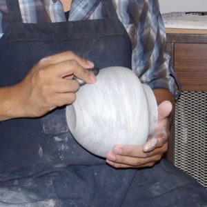 Polishing with a water-polished river stone