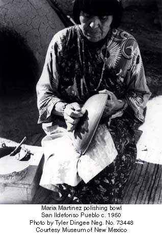 Maria polishing one of her pots with a smooth river stone