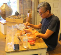 Hubert Candelario preparing to work on a piece