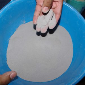 Clay being sifted for pebbles and other materials