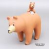 Dorothy Herrera, lcco3b100, Bear figure with a cub and a fish