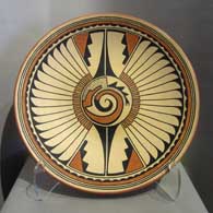 A San Ildefonso polychrome plate divided into 2 panels with a kiva altar, spiral, feather and geometric design