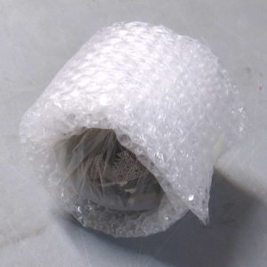 Rolling the piece up in enough bubble wrap to secure it