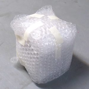 Turn 90 degrees again and put a third double-wrap of bubble wrap around the piece