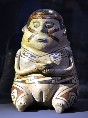 A Ramos Polychrome figure of a woman