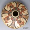 Poluychrome low-shoulder jar with a 4-panel bird element, katsina and geometric design
