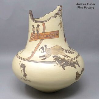 Polychrone jar with a stepped rim and decorated with a koshare, animal, bush and geometric design
