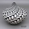 Cletus Victorino, zzac3b210, Tear drop jar with a geometric design