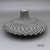 Paula Estevan, zzac3b242m3, Black and white jar with a distinctive flat shape, a square opening, and a geometric design
